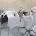 type 5 and 6 coveralls in a spray booth